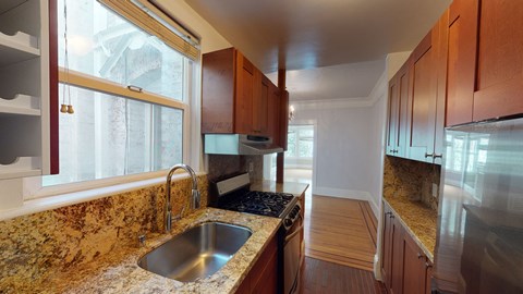 a kitchen with granite counter tops and a sink