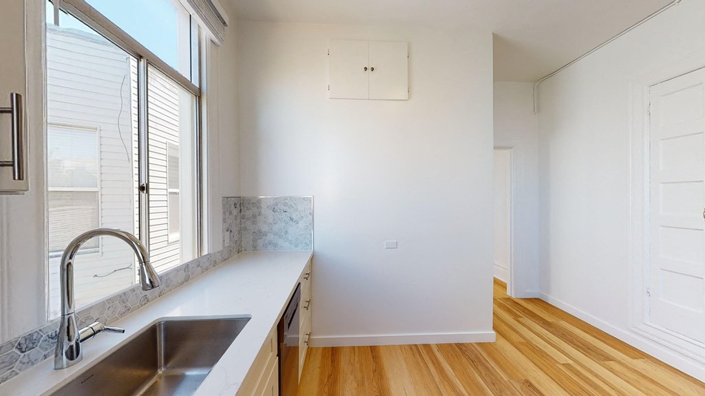 a kitchen with a sink and a window