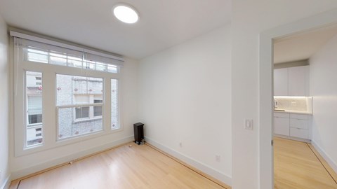 A room with a speaker on the floor.