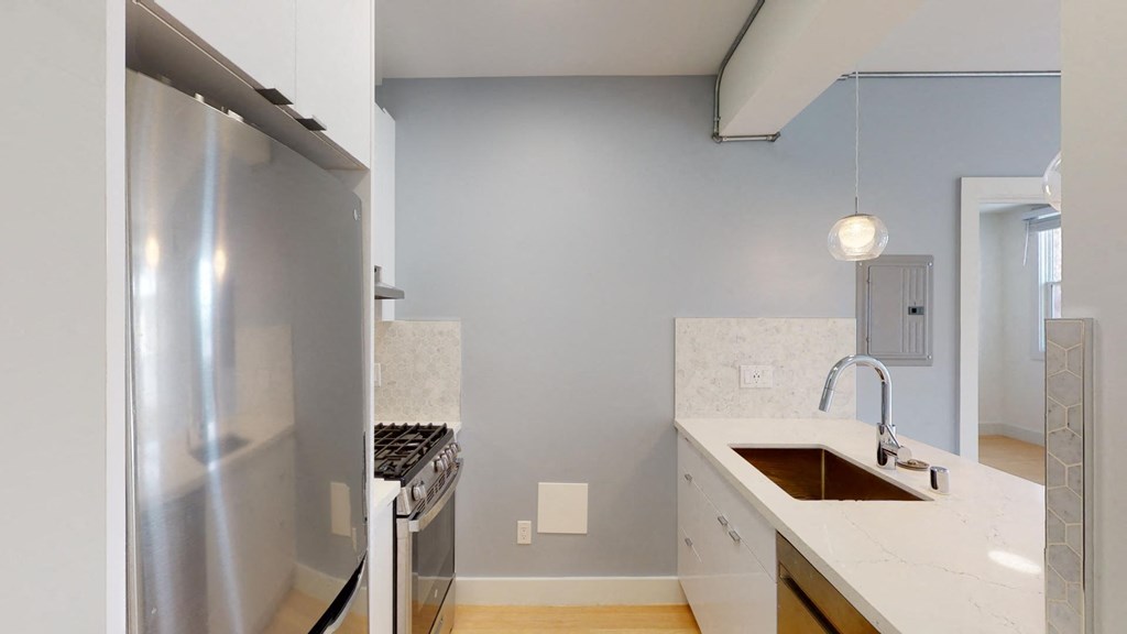 a kitchen with stainless steel appliances and a sink