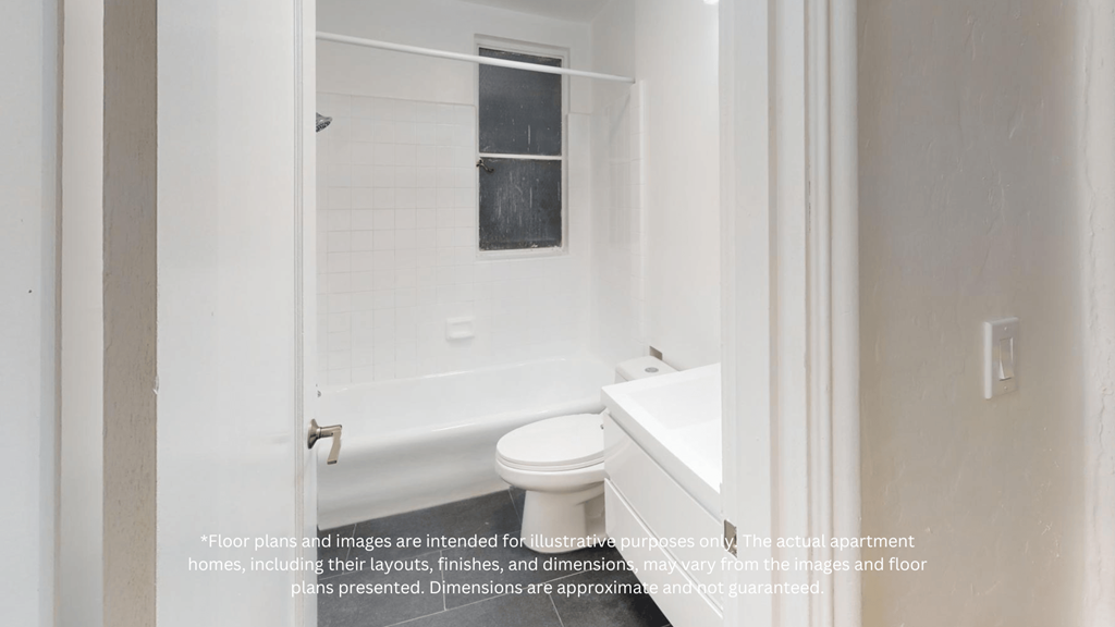 a white bathroom with a toilet and a sink