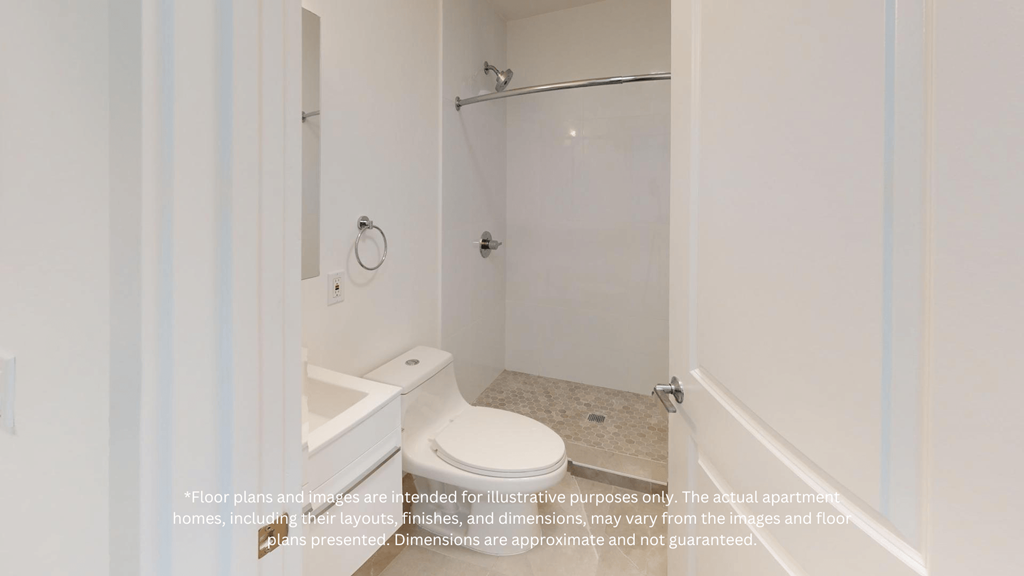 a white bathroom with a toilet and a shower