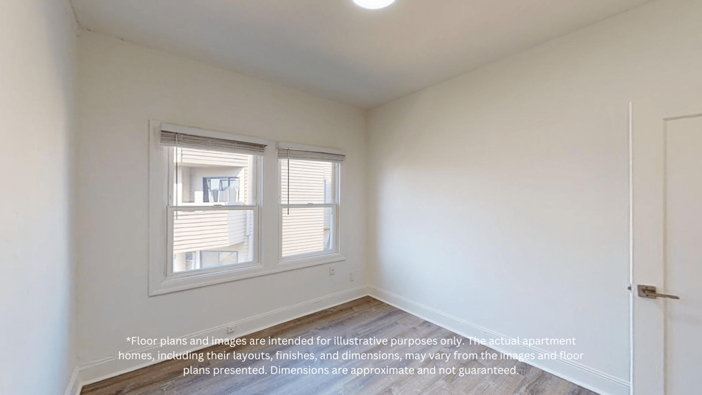 an empty room with a window and a door