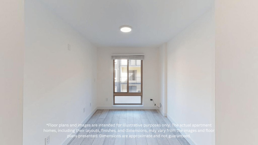 an empty room with a window and a door