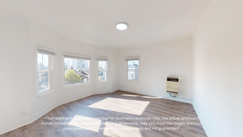 an empty living room with a bay window
