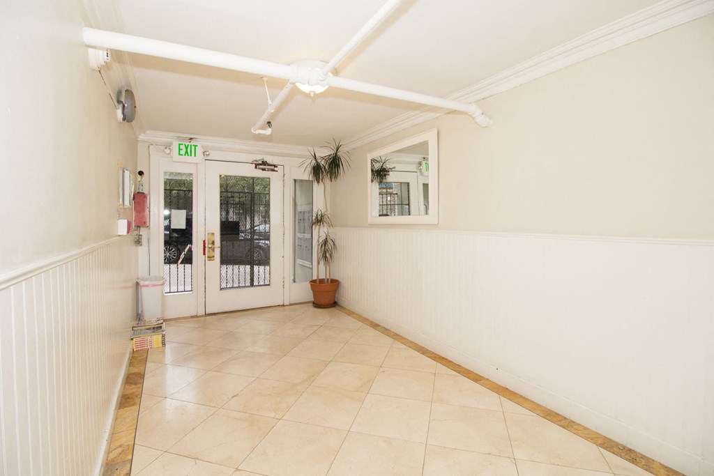 a room with a tile floor and a door to a patio