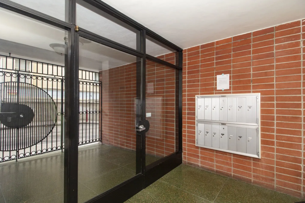 Main entrance door of the apartment building at 50 Joice St, San Francisco, CA 94108, United States
