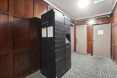 Hallway with a locker and an exit sign