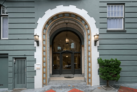 Main entrance door of the apartment building at 100 Broderick St, San Francisco, CA 94117, USA