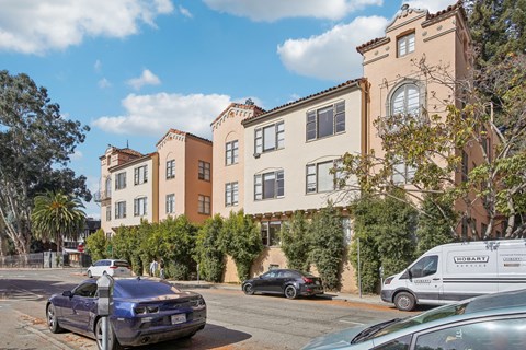 a row of apartment buildings on a city street