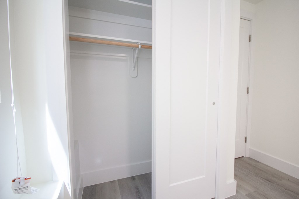 the closet in the master bedroom is empty and ready for the closet remodel