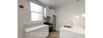 a white kitchen with a sink and a window