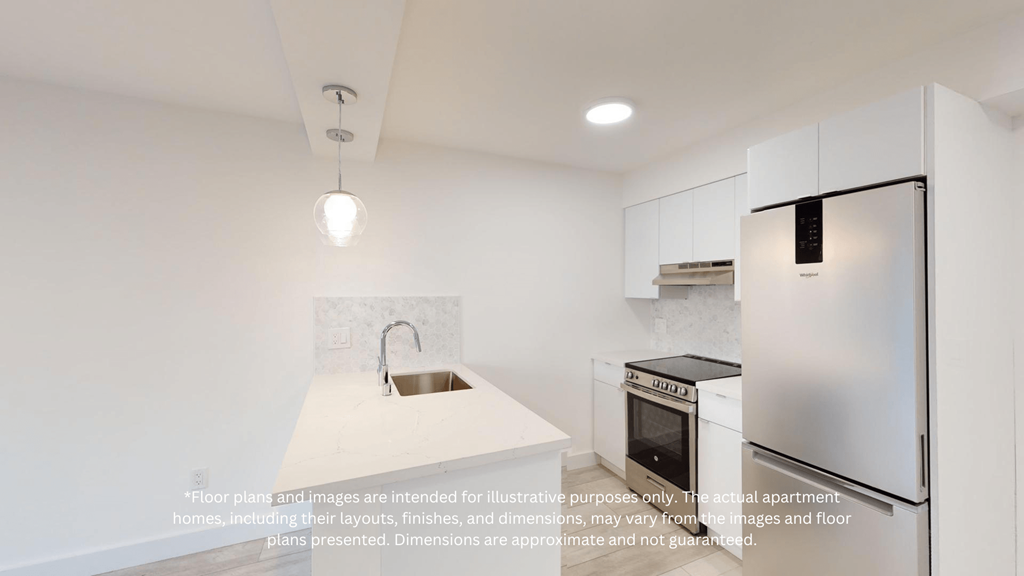 a white kitchen with a sink and refrigerator