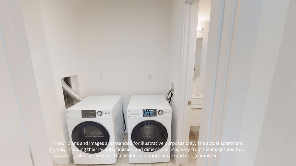 a white washer and dryer in a white laundry room
