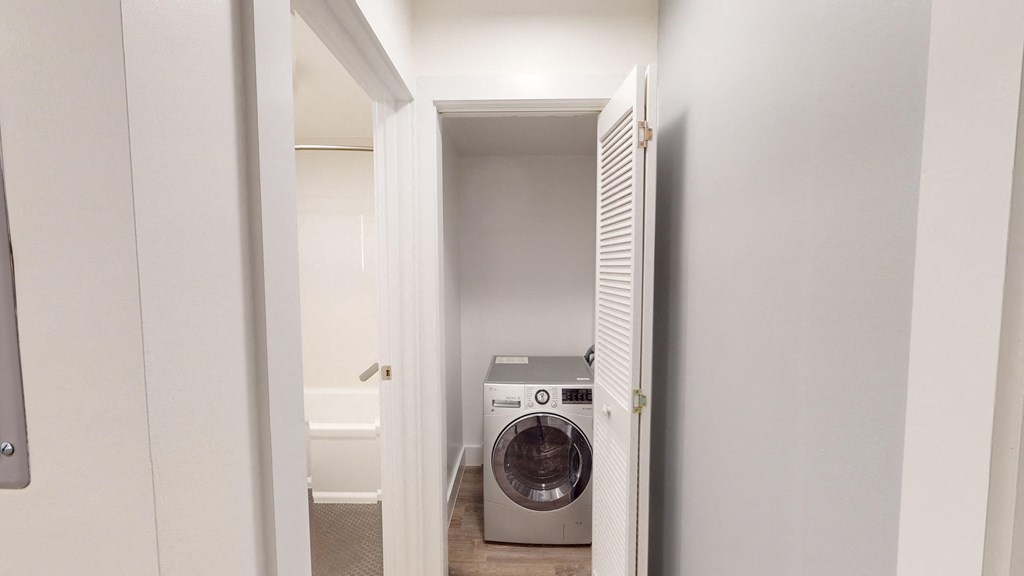 a small laundry room with a washing machine and a dryer