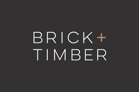 a black and white logo with the words brick  timber