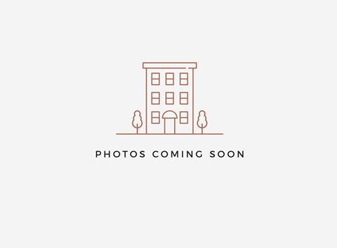 A placeholder image with a building and two people.