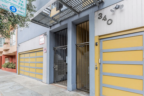 A yellow garage door is on the right side of the image.