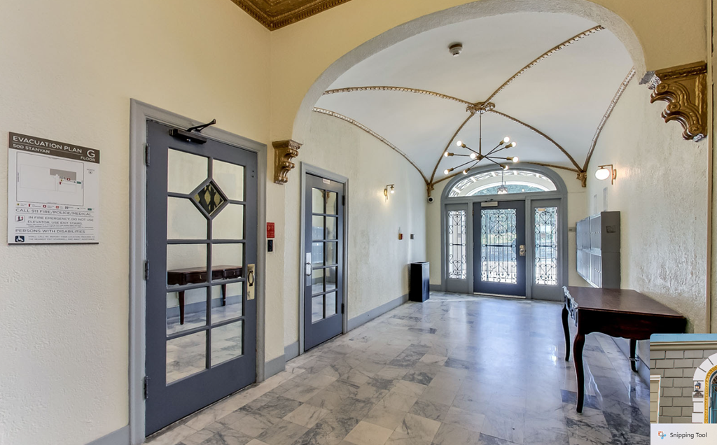 Hallway with a chandelier hanging from the ceiling