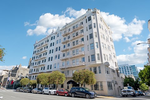A white building with a blue sky in the background.
