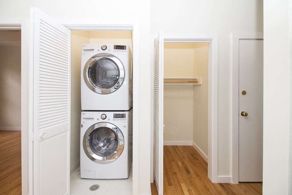 a washer and dryer in a small laundry room