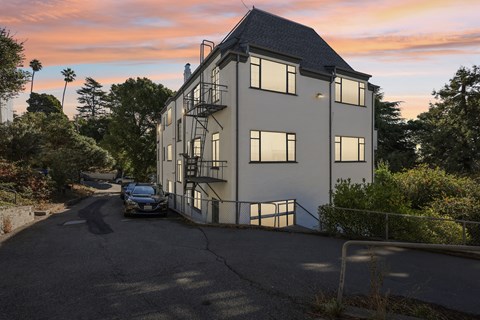 A house with a car parked in front of it.