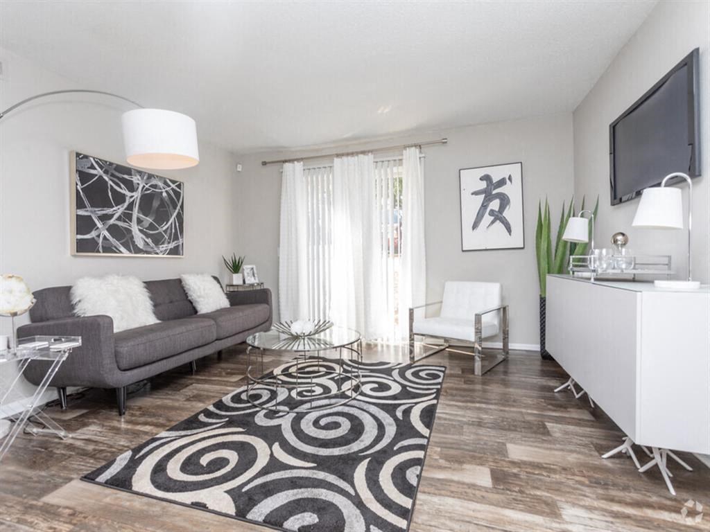 a living room with a couch and a tv at Tucker Square, Georgia