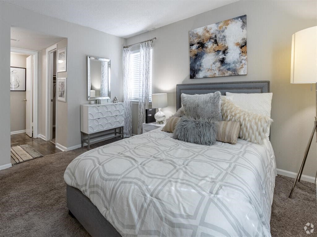 a bedroom with a bed and a closet at Tucker Square, Stone Mountain, 30083