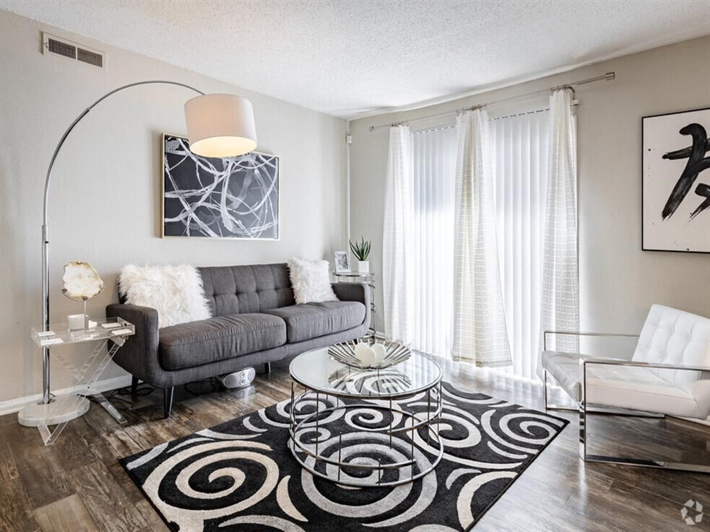 a living room with a couch and a table at Tucker Square, Stone Mountain, 30083
