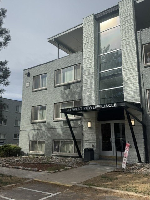 A building with a sign that reads "163 WEST POWER CIRCLE".