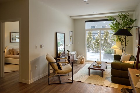A living room with a chair and a table.