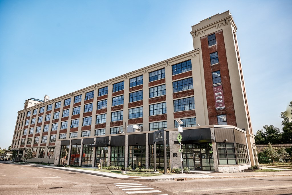 A large, modern building with a mix of brick and glass windows.