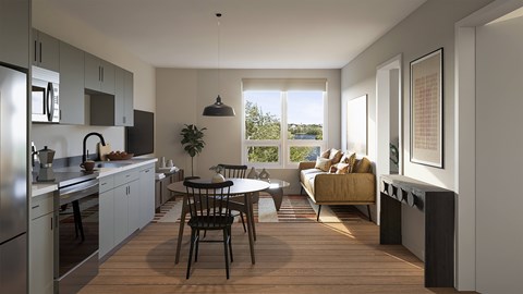 A modern kitchen with a dining table and chairs in the middle of the room.