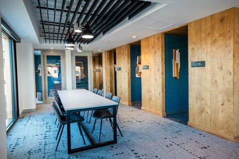 a conference room with a table and chairs