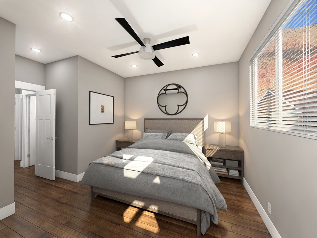 Bedroom With Fan, Large Window, and Hard Wood Flooring at Moenave Townhomes in Springdale, Utah