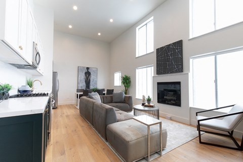 a living room with a couch and a fireplace