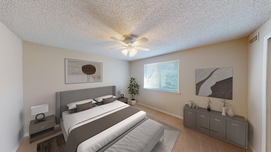 a bedroom with a bed and a ceiling fan