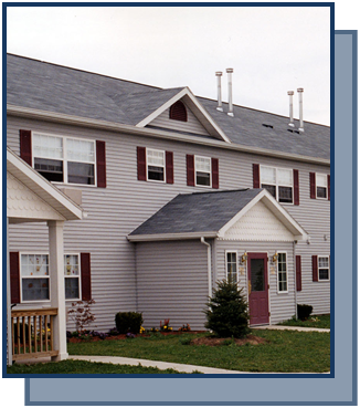 a white house with red shutters and a gray roof