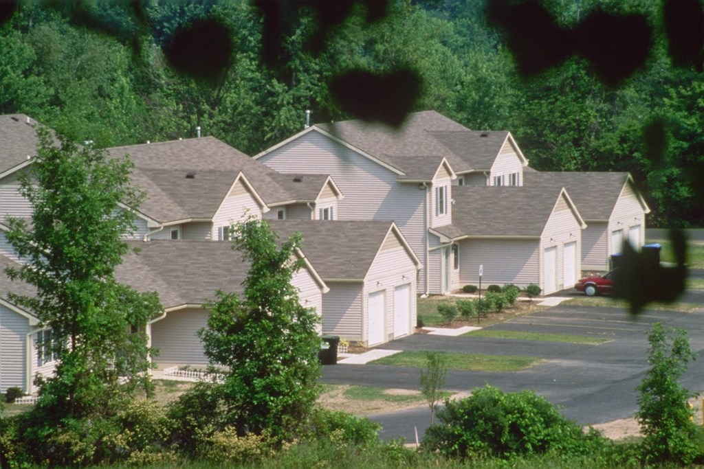 an aerial view of a row of houses in a neighborhood