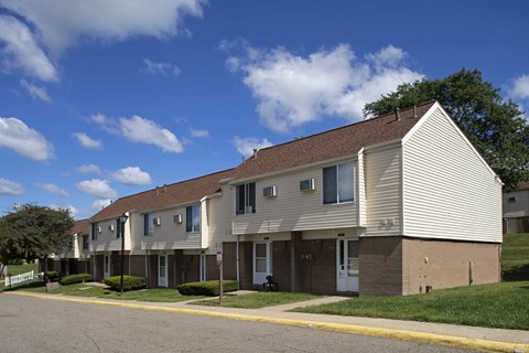 an apartment building on the corner of a street