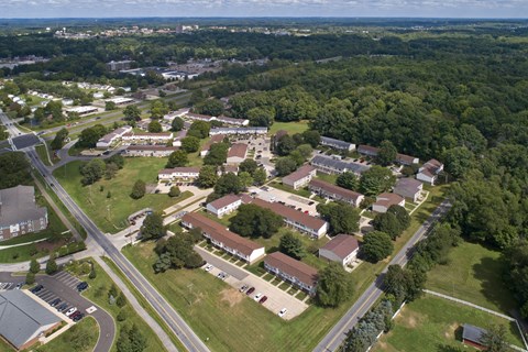 an aerial view of a city with houses and trees