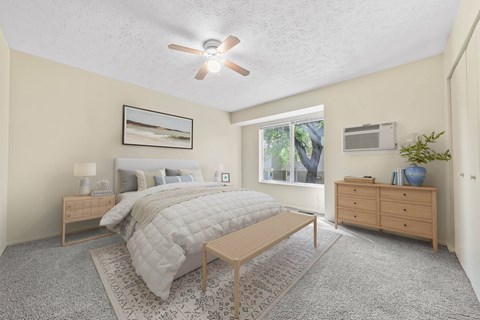 Bedroom with ceiling fan and wood furniture at Indian Valley Apartments, Ohio, 44240