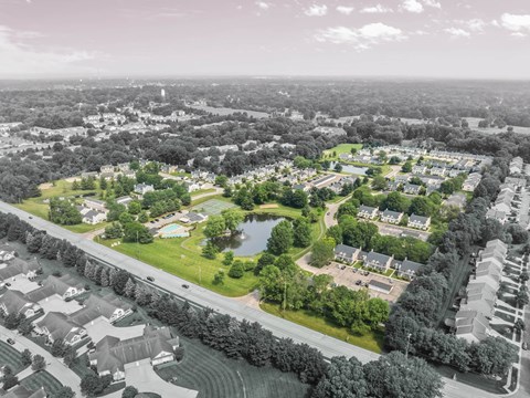 Aerial view of apartment community with pond at Hunters Lake Apartments, Cuyahoga Falls, OH