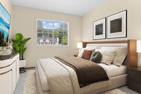 Bedroom with beige decor and modern artwork at Hunters Lake Apartments, Cuyahoga Falls, OH