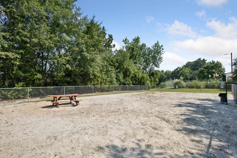 Fenced dog park with picnic table at Seasons Apartments, Georgia