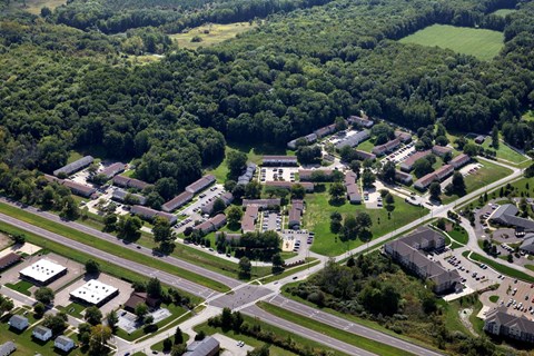 an aerial view of a city with buildings and trees