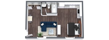 A top-down view of a living room with a blue couch, a white coffee table, and a grey sofa.