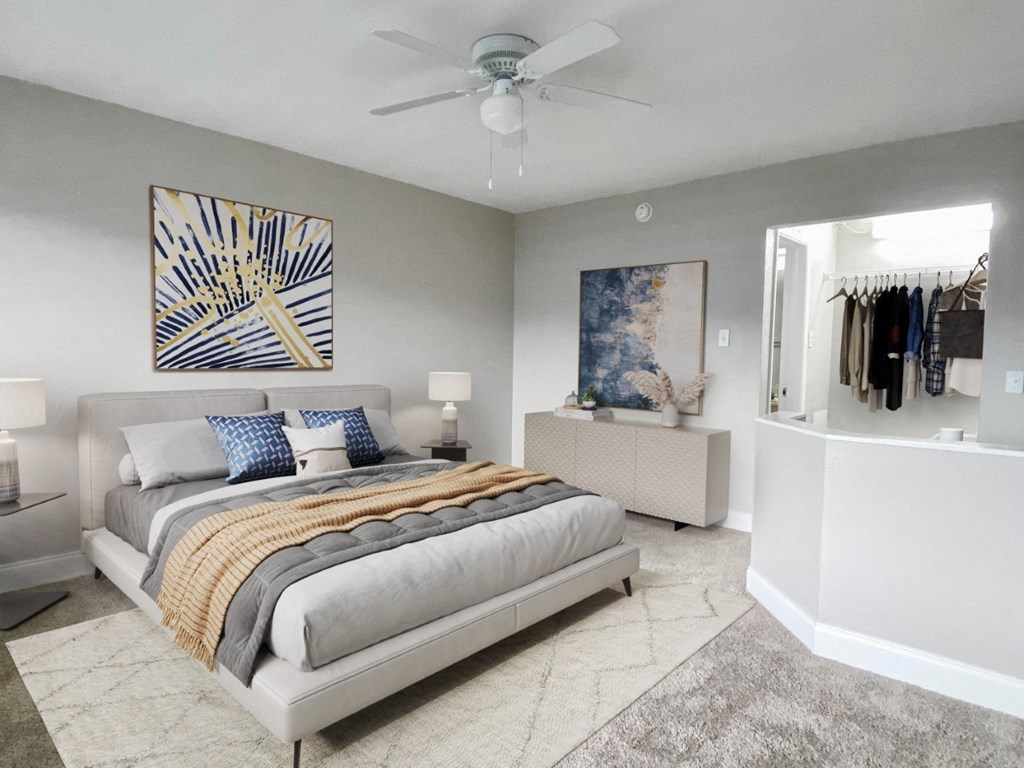 a bedroom with a bed and a ceiling fan