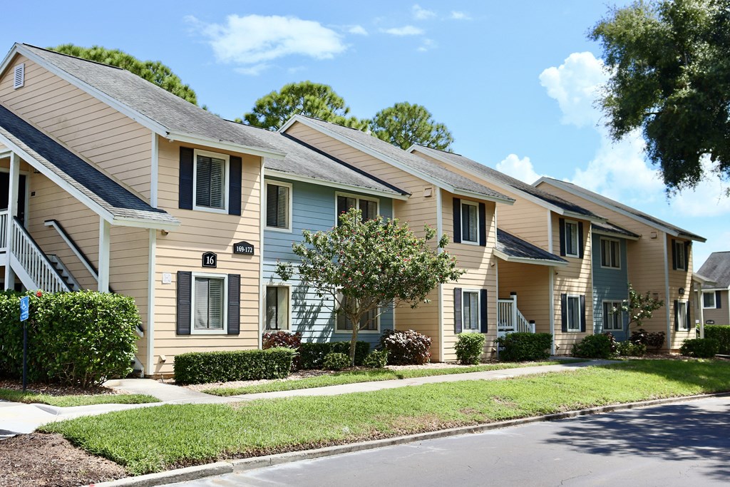 A row of houses with a clear blue sky above them.