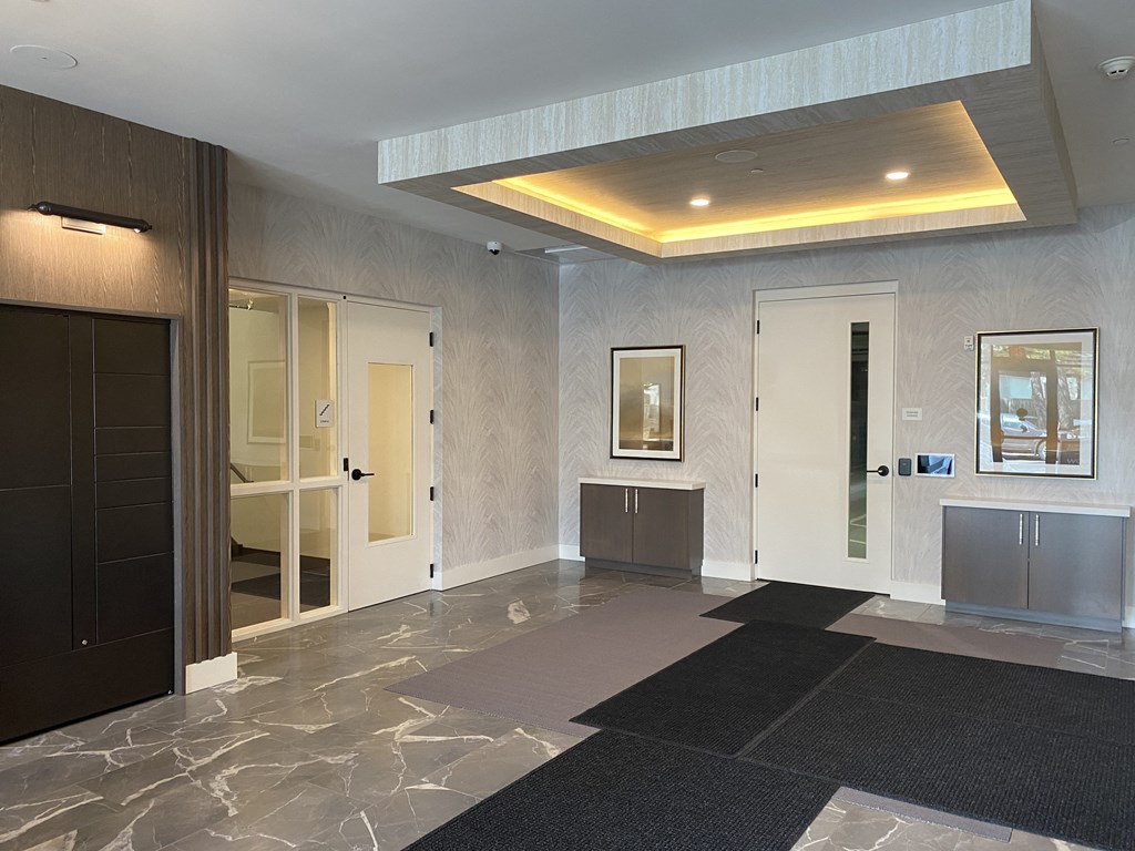 a view of the lobby of the hotel with the elevators on the left and the front